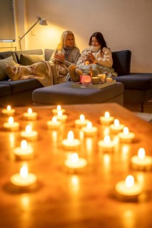 Symbolic image energy saving, cold winter, energy crisis, cold flat, mother and daughter lying on