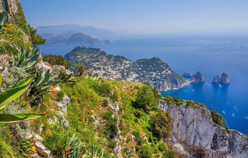 View from Monte Solaro 589m to the south coast with the Faraglioni rocks, the island's landmarks,