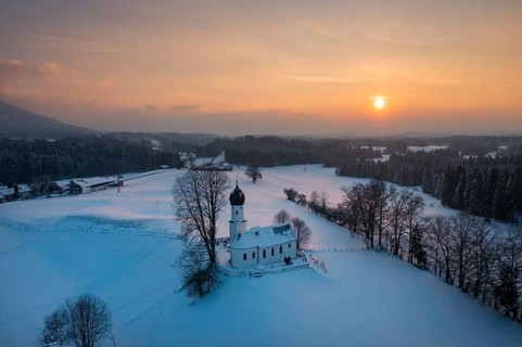 Sunset, Church of the Visitation of the Virgin Mary in winter, Oberbuchen, drone shot, Tölzer Land,