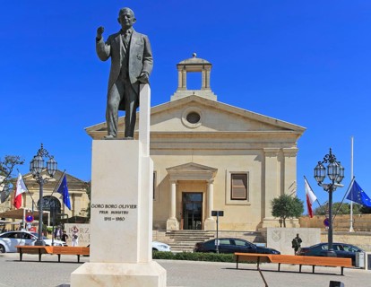 Stock Exchange building in former Garrison Chapel, Castille Square, Valletta, Malta statue of Prime
