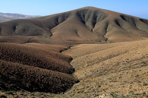 Bare moon-like arid landscape in mountains between Pajara and La Pared, Fuerteventura, Canary