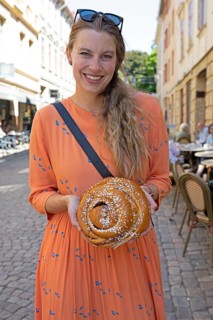 Swedish woman, 39 years old, with a traditional cinnamon bun, Haga neighbourhood, Gothenburg,