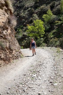 Woman walking in the the River Rio Poqueira gorge valley, High Alpujarras, Sierra Nevada, Granada