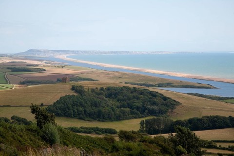 View west along Chesil beach tombolo from Abbotsbury to the Isle Portland, Dorset, England, UK
