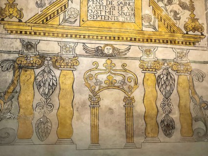 Saint-Nectaire. Ancient wall mural showcasing architectural elements in the church, Puy de Dome,