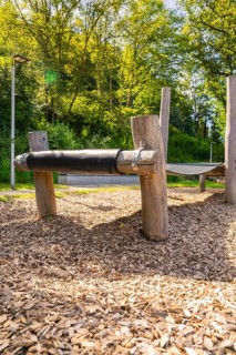 Close-up of a wooden bridge on a playground with wood chips as flooring, Nagold, Black Forest,