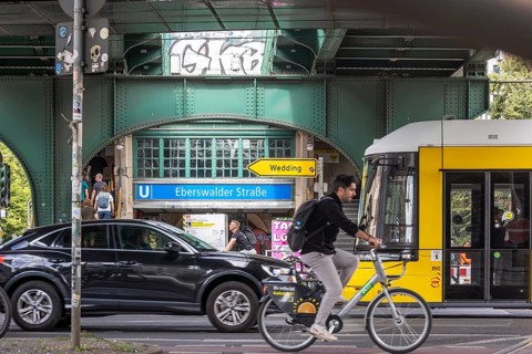 Transport by car, tram and bicycle. Underground station Eberswalder Straße at Prenzlauer Berg in