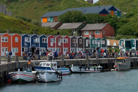 Colourful lobster shacks on the promenade in the lowlands, Börteboote, hospital in the midlands,