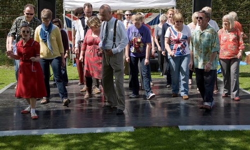 People performing dances to 1940s swing music during a country fair, Helmingham Hall, Suffolk,