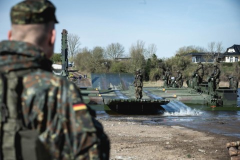 German soldiers of the NATO Response Force (NRF) train a water crossing with amphibious vehicles as