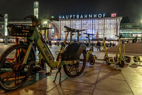 Cologne Central Station, station forecourt, evening, parked e-scooters, North Rhine-Westphalia,