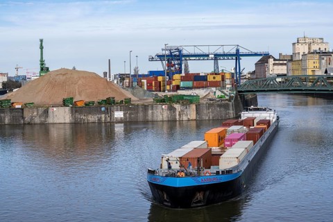 Container freighter Aarburg, leaving the container terminal in Frankfurt Osthafen, belonging to