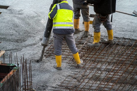 Construction site, concreting, floor, ceiling for a building is concreted, the concrete is pumped