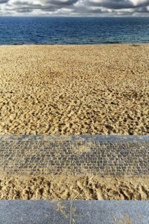 View from the empty sandy beach to the sea and cloudy sky, sunny autumn weather, full format, Wyk
