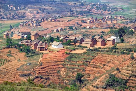 Terraced fields and two stories brick houses in Betsileo rural village in the Ambositra District,