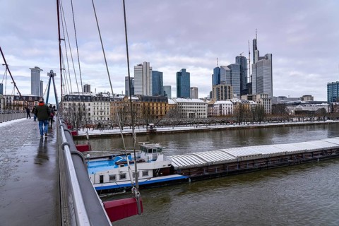 Winter in Frankfurt, view of the skyline of the city centre, from the Holbeinsteg foot and cycle