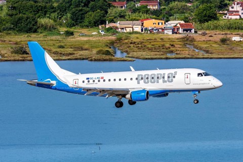 A Peoples Embraer 170 aircraft with the registration number OE-LMK at Corfu Airport, Greece, Europe