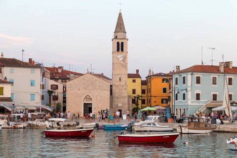 Fishing boats and colourful houses and church in Fazana, Istria, Croatia, Europe