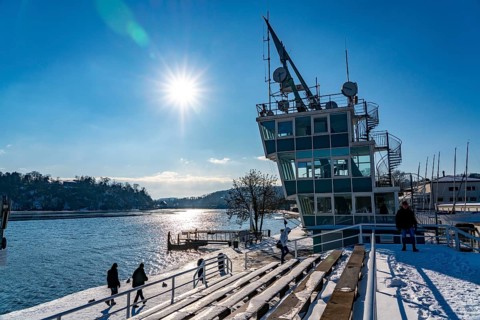 Winter in the Ruhr area, Lake Baldeney, snow-covered, partly frozen lake, regatta tower, grandstand
