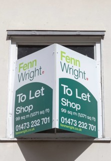 Shop to Let estate agent sign Fenn Wright estate agents, Ipswich, Suffolk, England, UK
