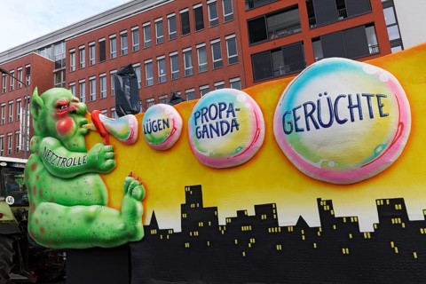Internet troll with soap bubbles lies, propaganda, rumours, fake news, Rheinische Post newspaper