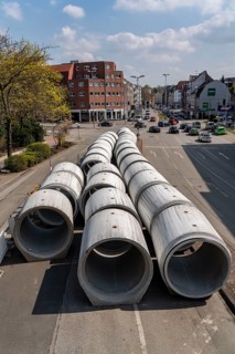 Concrete sewer pipes, stored on a construction site during sewer renovation work, on the Dickswall,