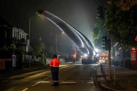 Transport of a 68 metre long, 22 tonne blade of a wind turbine, here in Breckerfeld, with a