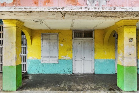 Closed, dilapidated building with peeled off house wall in pastel shades, pastel, green,