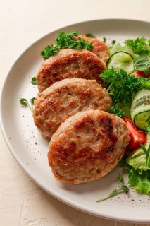 Fried cutlets, turkey, with vegetable salad, top view, no people