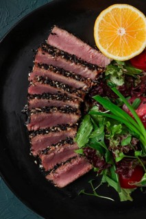 Vegetable salad, with fried tuna, in sesame seeds, healthy food, top view