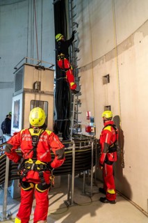 Height rescuers from the Oberhausen professional fire brigade practise abseiling from a wind