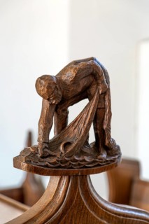 Carved wooden finial figure of fisherman c 1930s by Captain Jackson, Westleton church, Suffolk,