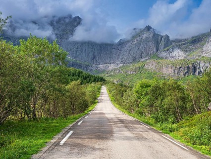 Steep granite cliffs at the road to Nusfjord, narrow single track road, Nusfjord, Flakstadøy,