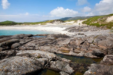 Rocky headland and sandy beach at Bagh a Deas, South Bay, Vatersay island, Barra, Outer Hebrides,
