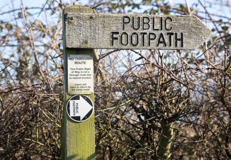 Close up wooden public footpath sign, no through route due to coastal erosion, River Deben,