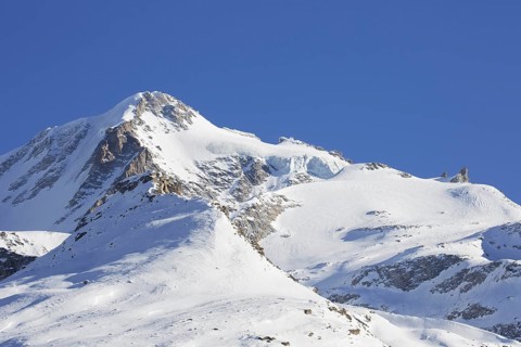 Snow covered mountaintop, pinnacle of the Gran Paradiso mountain in winter in the Gran Paradiso
