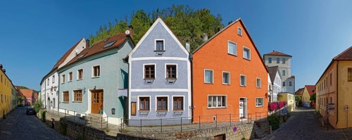 Vils alley with colourful houses and clear sky casting shadows, Kallmünz, Upper Palatinate,