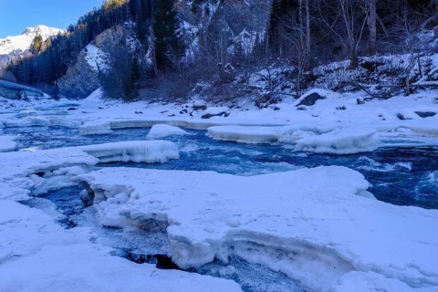 Inn or En near Scuol in winter, with ice floes, Engadin, Grisons, Switzerland, Europe