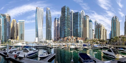 Dubai Marina skyline skyscrapers with yachts property skyscrapers living on the water panorama in