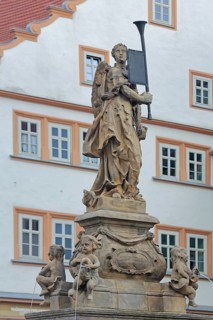 Sculpture at the Schellenbrunnen, trumpet, holding, coat of arms, free-standing, main market,
