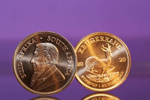 Close-up of two Krugerrand gold coins