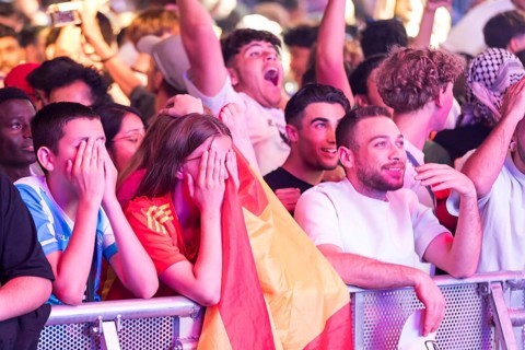 Fans of the Spanish team fear after the equalising goal by England at the Adidas fan zone at the