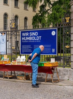 Tourists at the flea market stall in front of Humboldt University, Unter den Linden, Berlin,