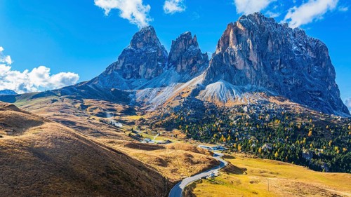 The peaks of the Sassolungo Group, Passo Sella, drone shot, Val Gardena, Dolomites, Autonomous