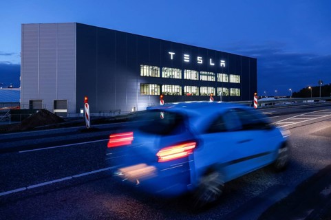 A car drives past the battery factory of the Tesla plant, Grünheide, 13.01.2023