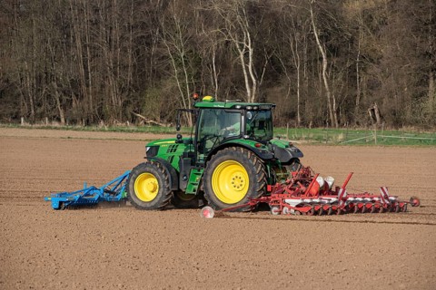 Sugar beet being sown in spring, precision sowing with precision seed drill, behind a tractor,