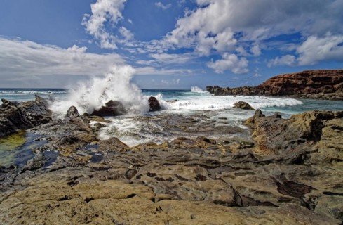 Lava rocks at the Playa de los Ciclos near the Green Lake, Lago Verde, El Golfo, Lanzarote, Canary