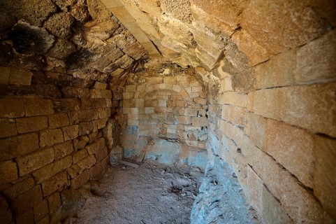 Interior view of an old building with stone walls and vaulted ceiling, tomb of Cleovoulos the