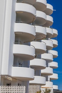 Modern holiday flats with round balconies at the harbour of Santa Eularia, Ibiza, Balearic Islands,