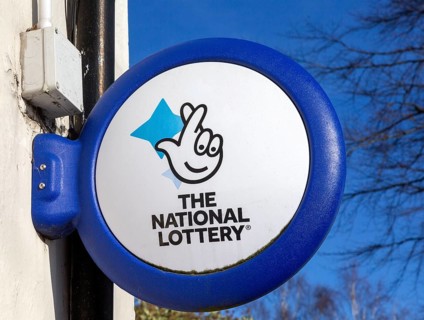 Close up of The National Lottery fingers crossed sign, UK
